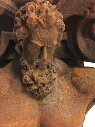 Very striking wall bracket -ornament with garing man, Polystone rest.